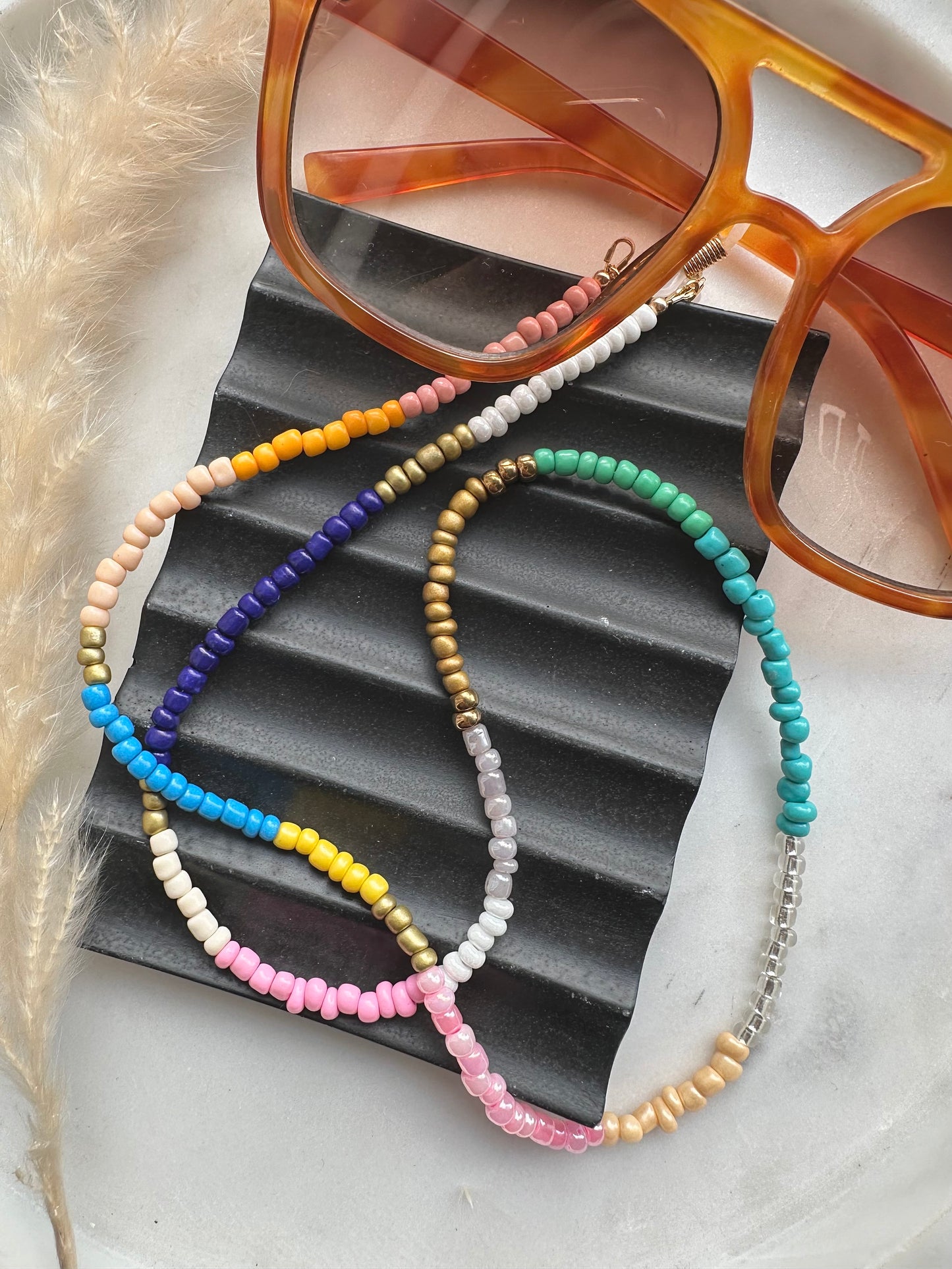 Multi-coloured seed bead sunglasses chain