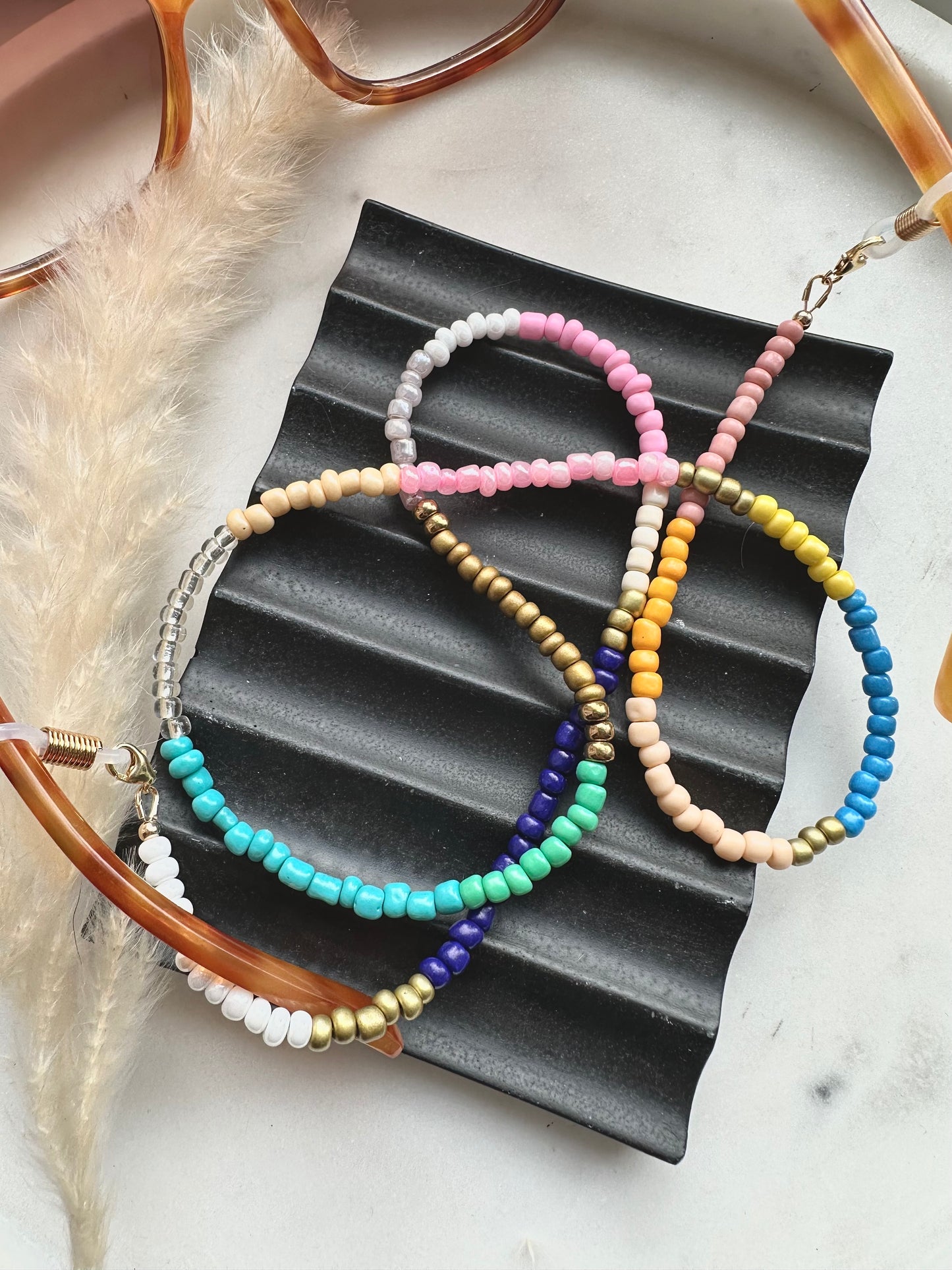 Multi-coloured seed bead sunglasses chain