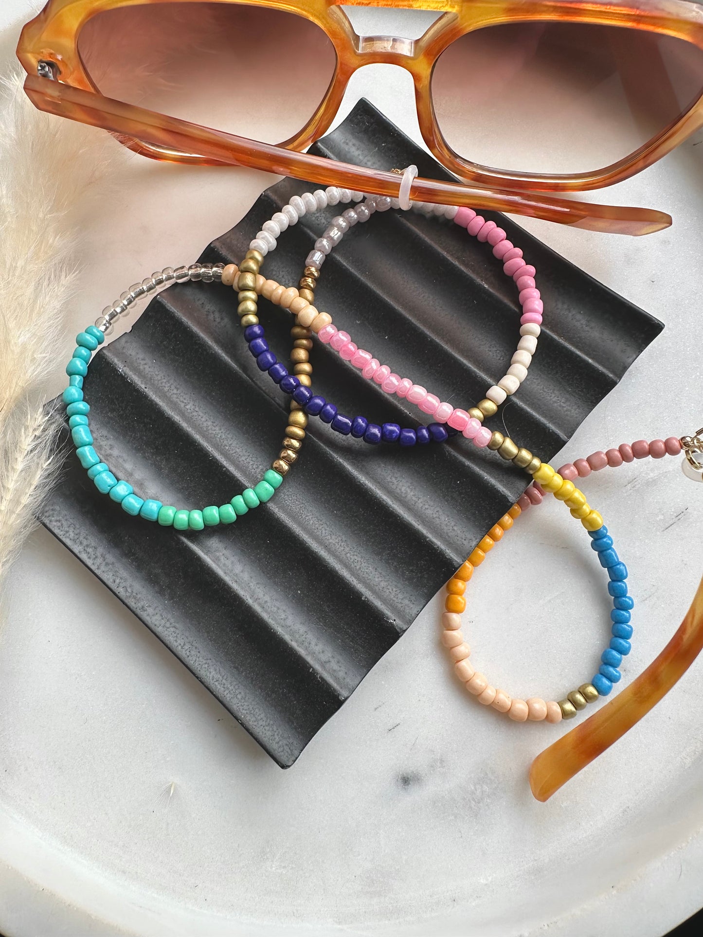 Multi-coloured seed bead sunglasses chain