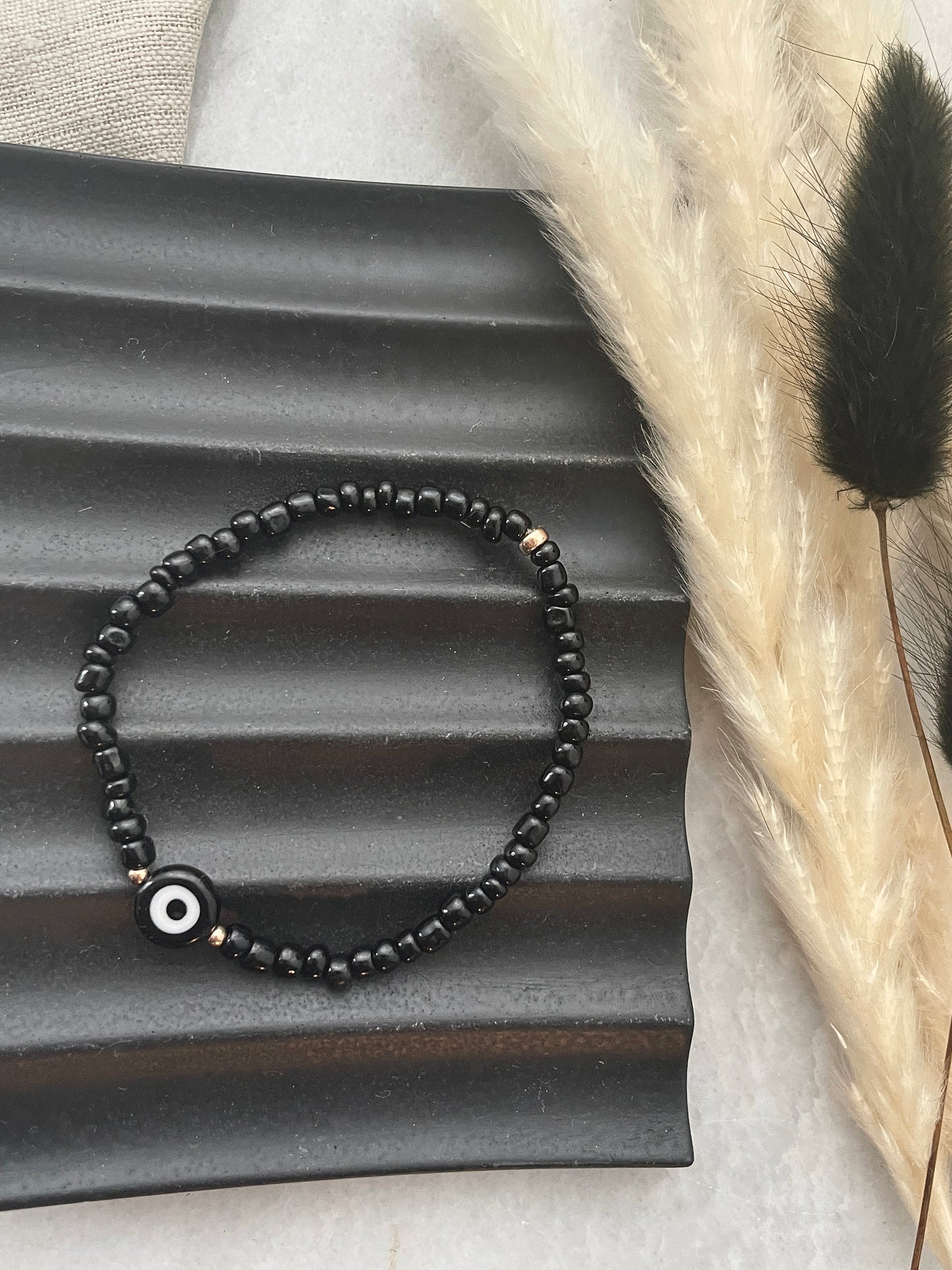 Evil eye seed bracelet