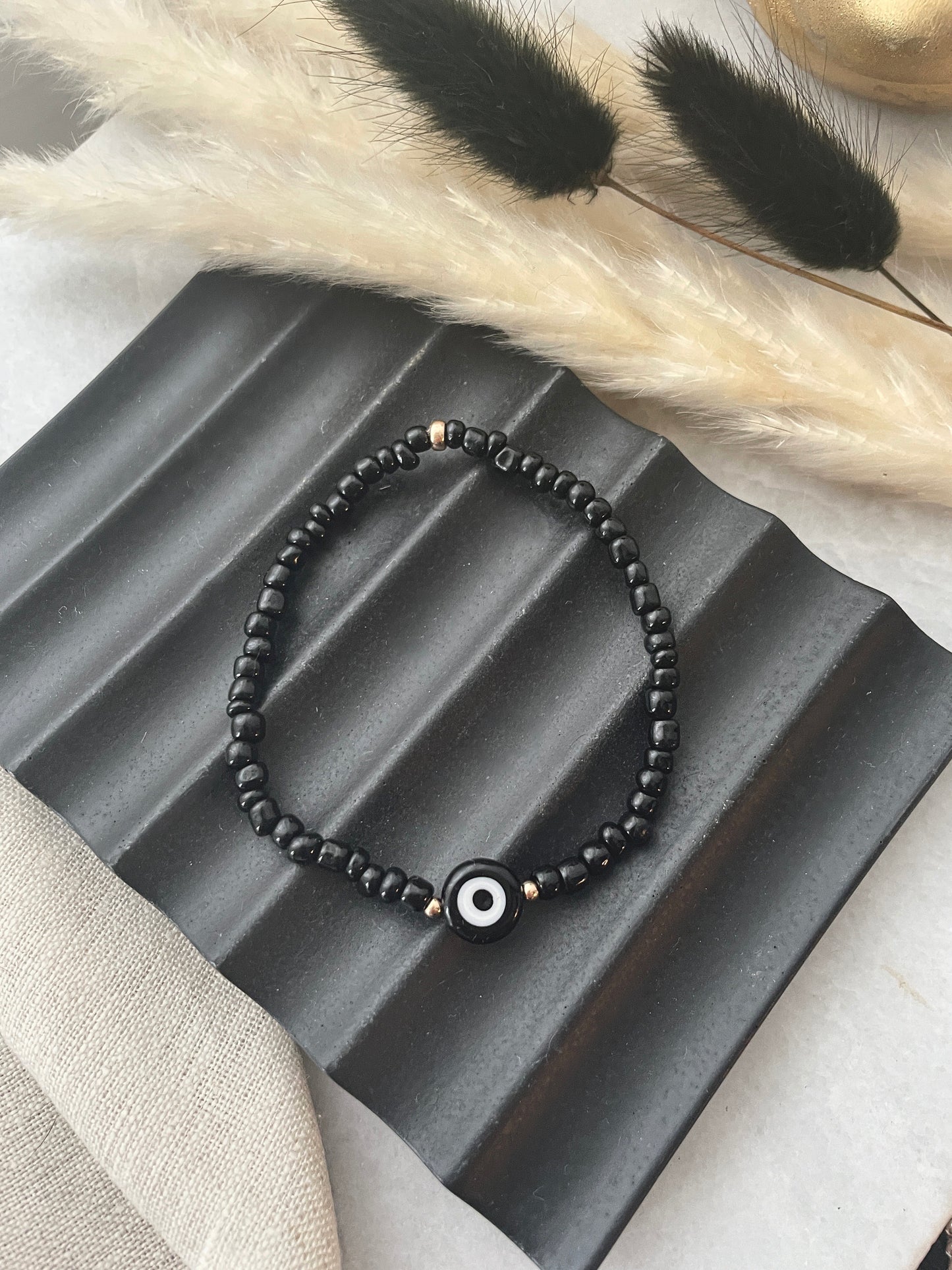 Evil eye seed bracelet